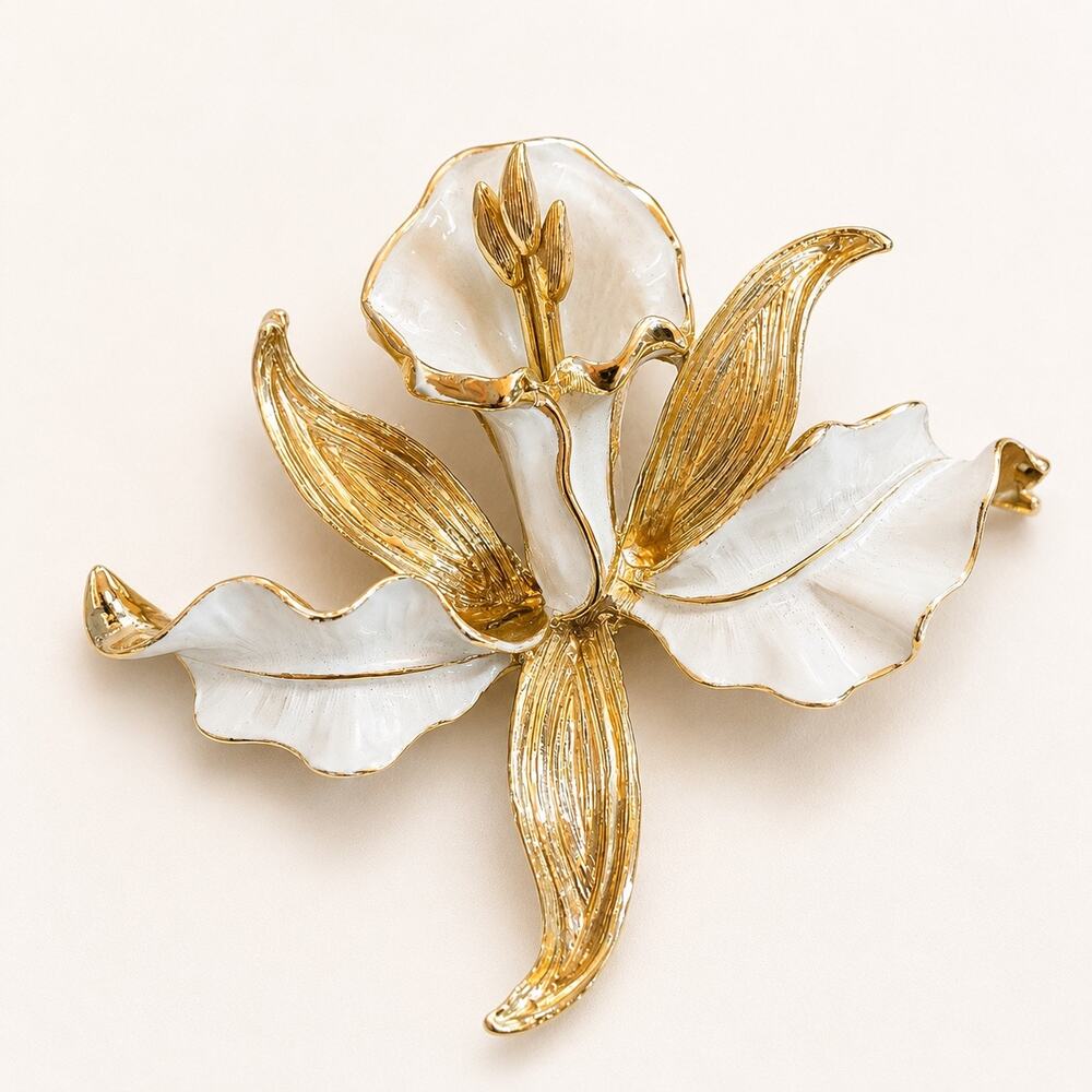 Vintage gold tone and white enamel floral brooch